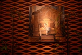 Репродукцию картины с маленьким Буддой охраняет золотой лев.