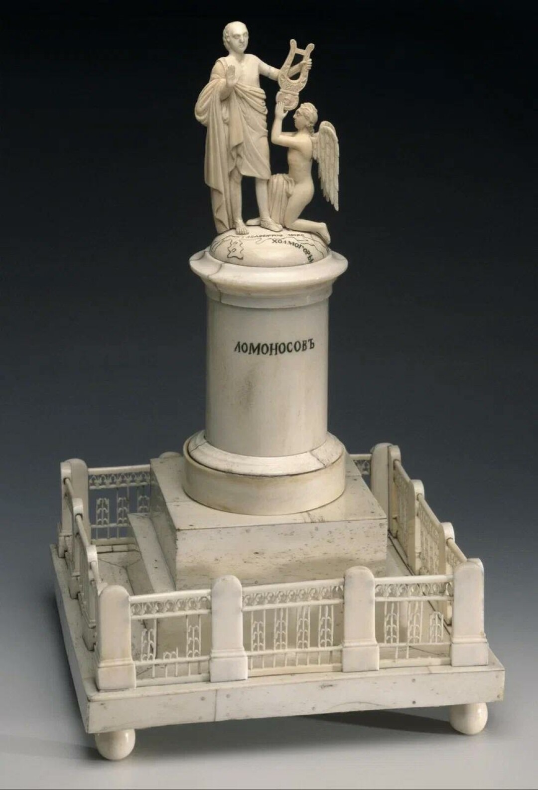 Модель памятника Ломоносову с географической картой и надписью "Ломоносовъ". XIX век