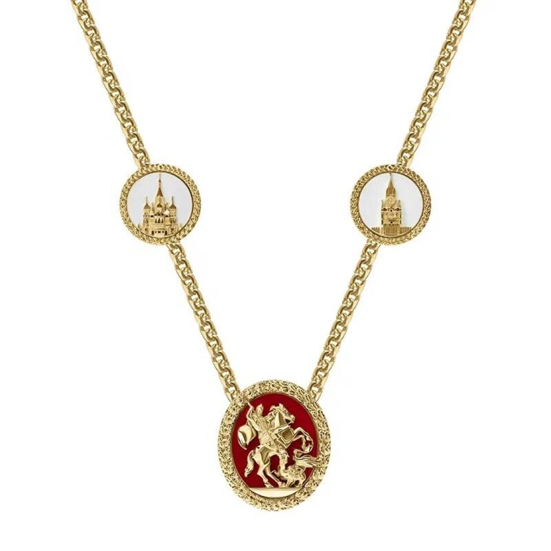 Цепь и медальон выполнены из золота или серебра с позолотой, с геральдическим щитом, покрытым темно-красной эмалью с изображением святого Георгия